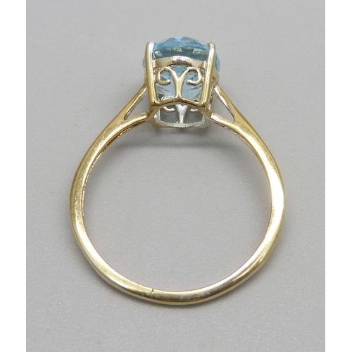 1030 - A silver gilt and blue stone solitaire ring, Q