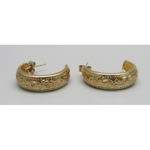 1031 - A pair of embossed 9ct gold hoop earrings and butterflies, 0.9g