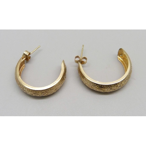 1031 - A pair of embossed 9ct gold hoop earrings and butterflies, 0.9g