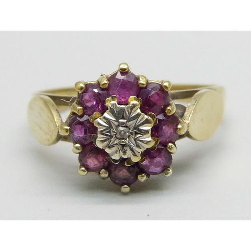 1032 - A 9ct gold, ruby and diamond cluster ring, 2.7g, P