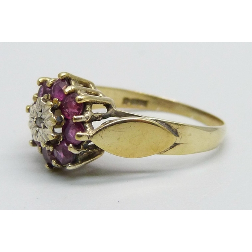 1032 - A 9ct gold, ruby and diamond cluster ring, 2.7g, P