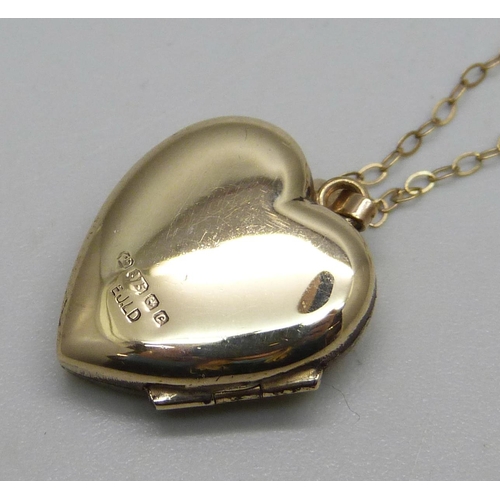 1036 - A 9ct gold locket and chain, 2.6g