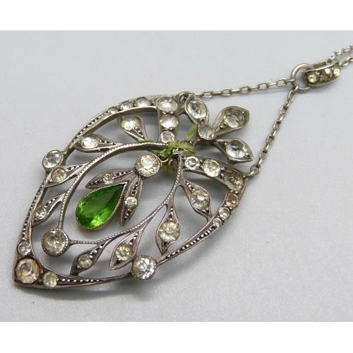 1037 - A white metal and stone set pendant and chain, drop requires repair