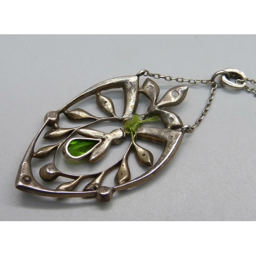 1037 - A white metal and stone set pendant and chain, drop requires repair