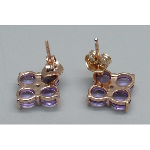 1038 - A pair of silver gilt, pink cabochon stone and zircon earrings