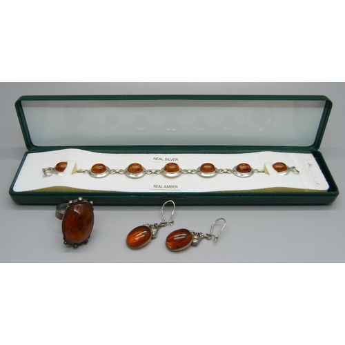 1043 - A silver and amber set bracelet and a silver and amber ring, L, and pair of earrings