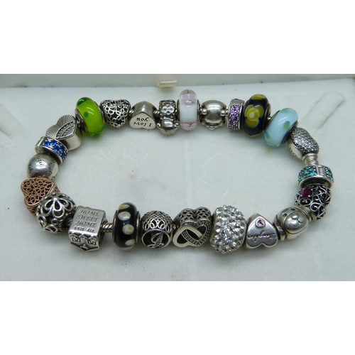 1047 - A Pandora charm bracelet including Disney Winnie the Pooh, (one charm not Pandora)