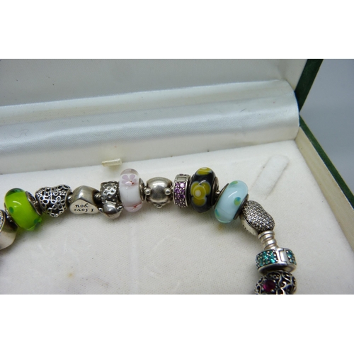 1047 - A Pandora charm bracelet including Disney Winnie the Pooh, (one charm not Pandora)