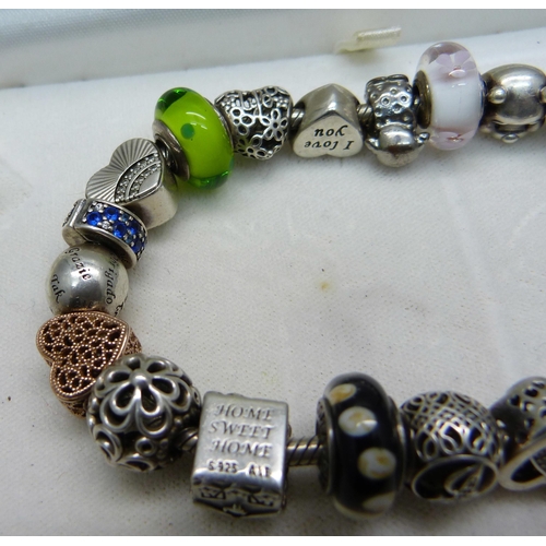 1047 - A Pandora charm bracelet including Disney Winnie the Pooh, (one charm not Pandora)