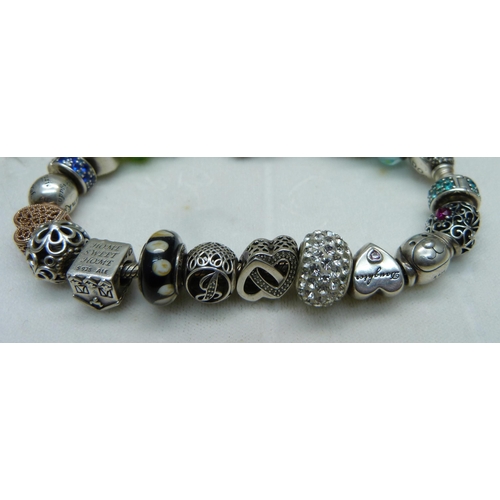 1047 - A Pandora charm bracelet including Disney Winnie the Pooh, (one charm not Pandora)