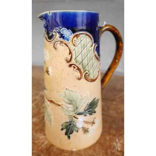 1055 - A Royal Doulton Slaters floral design Lambeth stoneware jug, 17cm, small chip to the spout