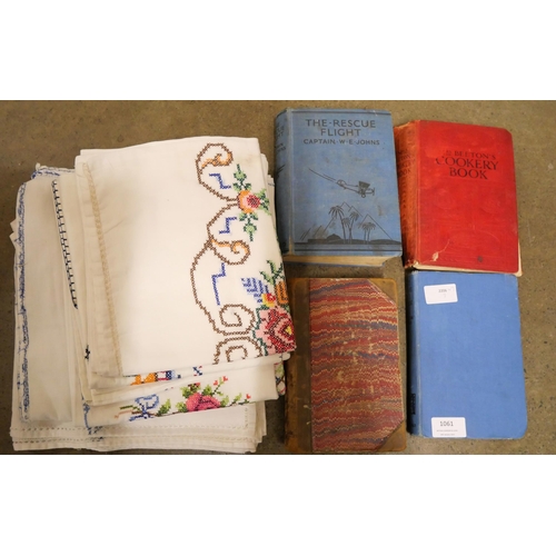 1061 - A small collection of needlework, table linen and four books including History of France by Mrs Mark... 