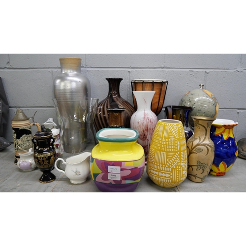 1081 - A collection of large vases including glass, a globe, a drum, etc. **PLEASE NOTE THIS LOT IS NOT ELI... 