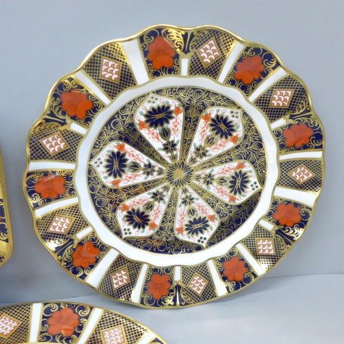 605 - Three Royal Crown Derby 1128 Old Imari pattern plates, wavy edge, octagonal and traditional, all sec... 
