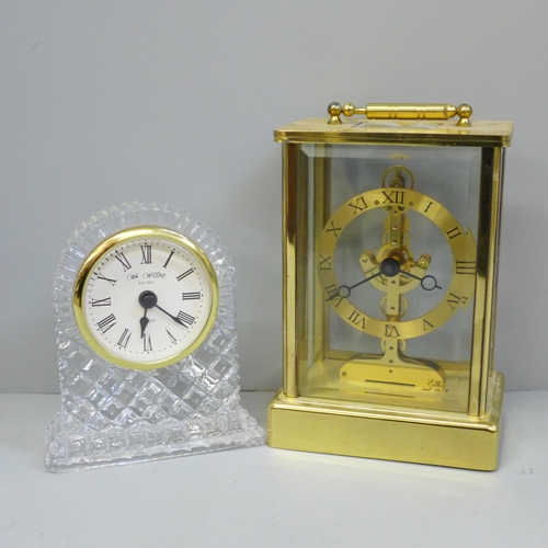 611 - An Emes brass and glass clock, battery movement and one other lead crystal dome top clock