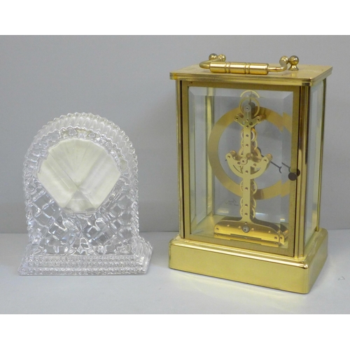 611 - An Emes brass and glass clock, battery movement and one other lead crystal dome top clock