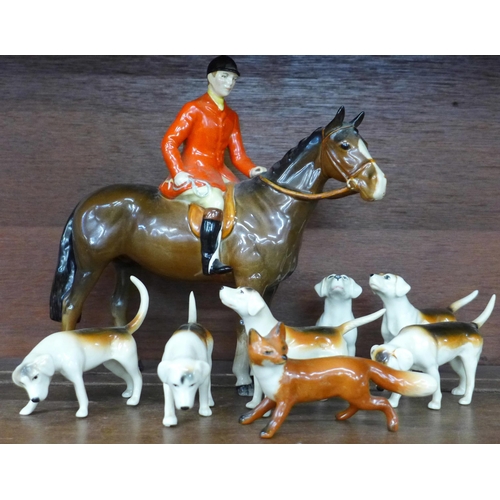 621 - A Beswick huntsman on brown horse, model 1501, six hounds and fox