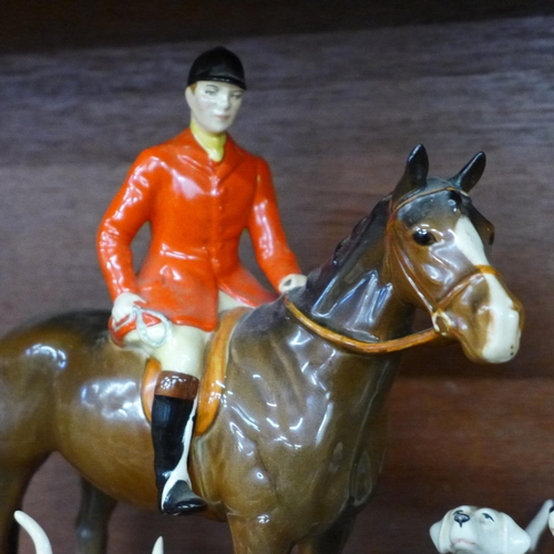 621 - A Beswick huntsman on brown horse, model 1501, six hounds and fox