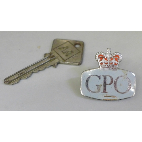 628 - A box of car badges, AA, The Camping Club, The National Trust, etc. (10) AA key and GPO badge