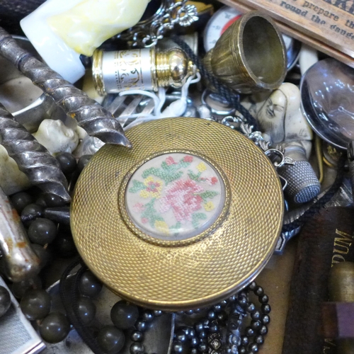 690 - A compact, pill box, porcelain figures, napkin rings, nutcrackers, etc.