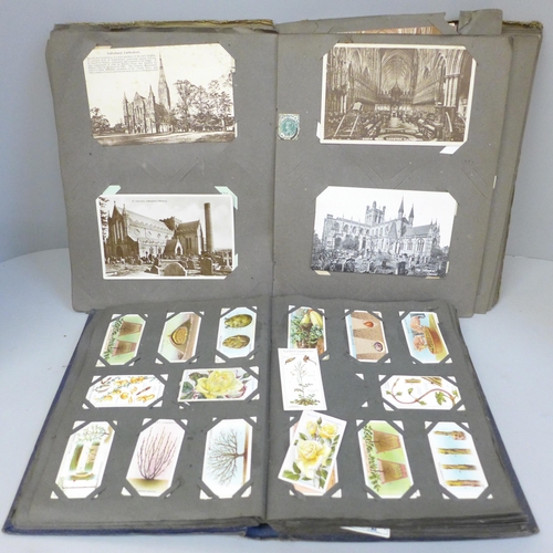 695 - An albums of church postcards and an album of Edwardian cigarette cards