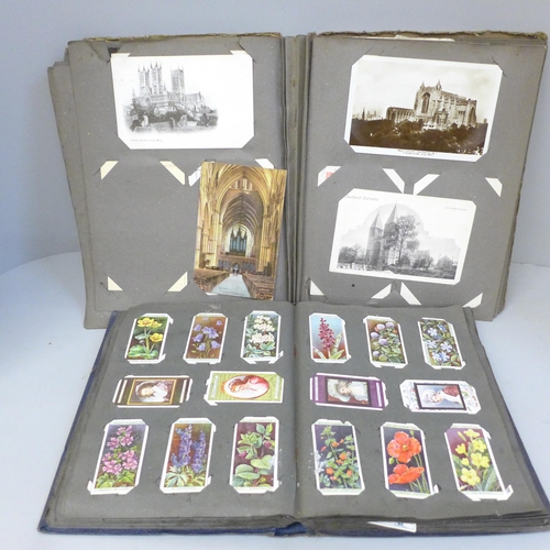 695 - An albums of church postcards and an album of Edwardian cigarette cards