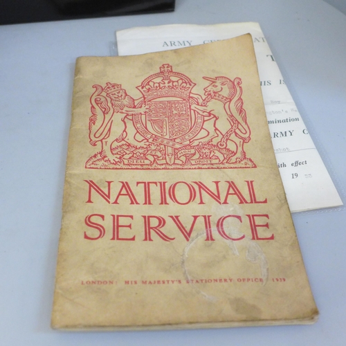 708 - Military ephemera; a box of military ephemera including official publications, postcards, etc.