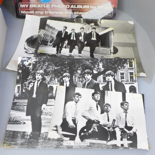 709 - The Beatles memorabilia including photographs, magazines, scrapbook and The Beatles holographic pend... 