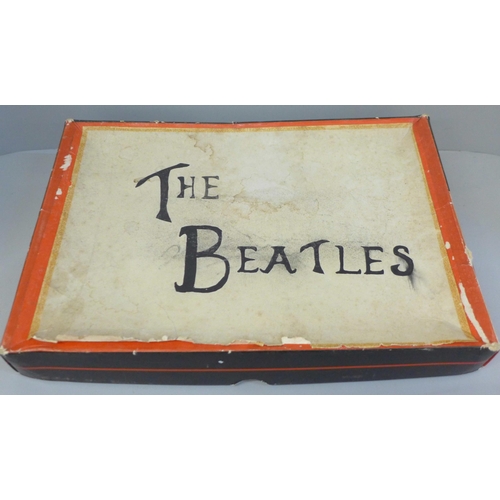 709 - The Beatles memorabilia including photographs, magazines, scrapbook and The Beatles holographic pend... 