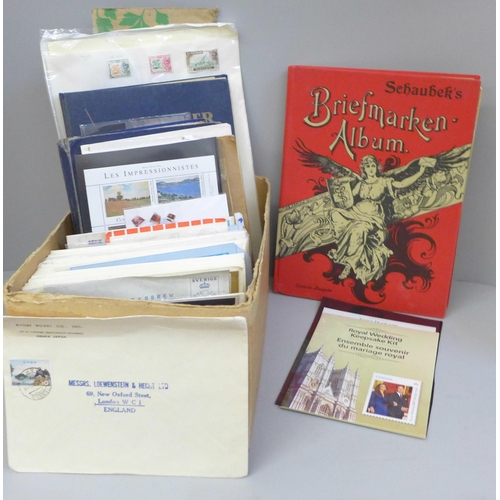 712 - Stamps; a box of stamp albums, covers, etc.