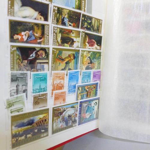 712 - Stamps; a box of stamp albums, covers, etc.