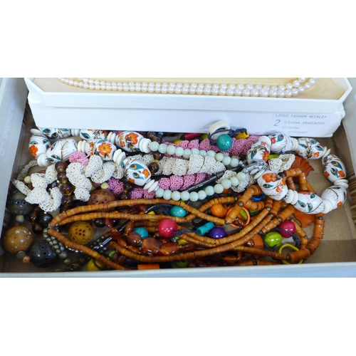 717 - Costume jewellery; assorted beaded necklaces and bracelets, including boxed Lotus simulated pearls