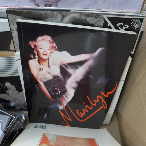 732 - A box of Marilyn Monroe memorabilia including prints, calendars, books, etc.