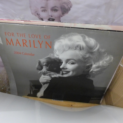 732 - A box of Marilyn Monroe memorabilia including prints, calendars, books, etc.