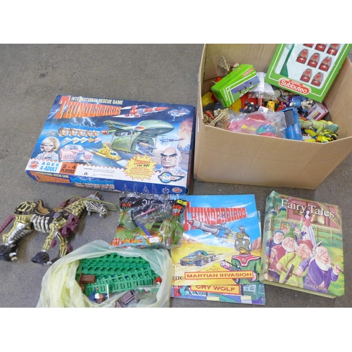 752 - A Thunderbirds International Rescue board game and a box of children's toys, Subbuteo, die-cast vehi... 