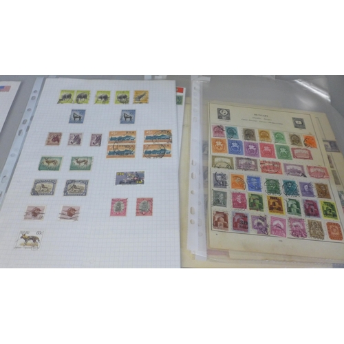 759 - A collection of postage stamps and a page of Tonga Air Mail stamps