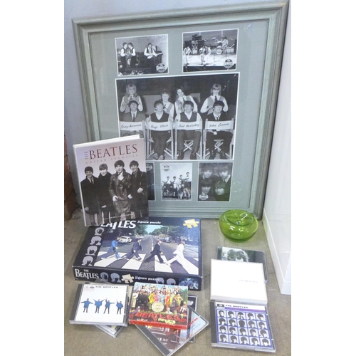 780 - A collection of The Beatles memorabilia including CDs (11), book, jigsaw puzzle, a glass apple and a... 