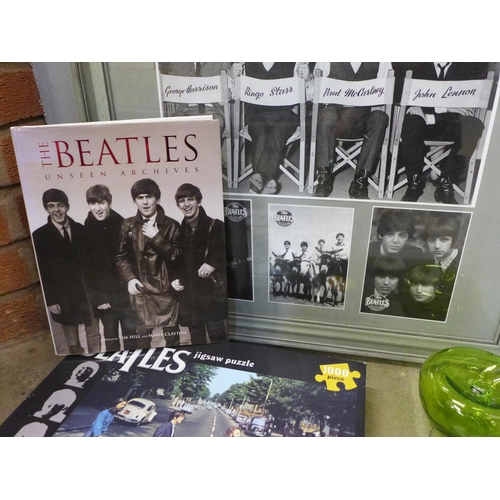 780 - A collection of The Beatles memorabilia including CDs (11), book, jigsaw puzzle, a glass apple and a... 