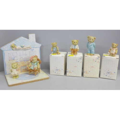 786 - A Cherished Teddies house display stand and three bears, boxed