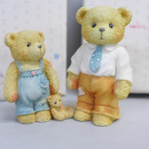 786 - A Cherished Teddies house display stand and three bears, boxed