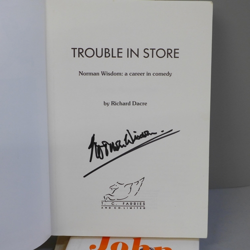 792L - Autographed comedy books, Ronnie Barker, John Cleese, Norman Wisdom and Spike Milligan (4)