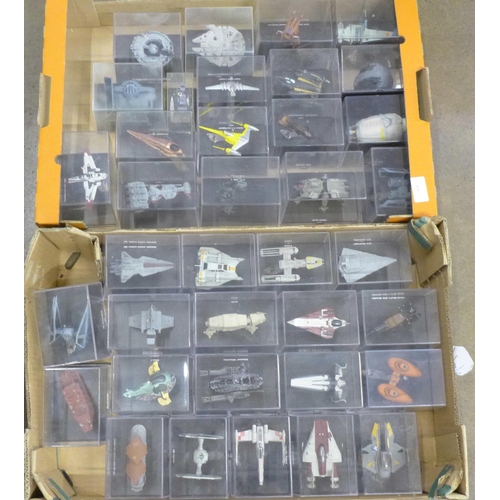 802 - A collection of forty Star Wars vehicles in perspex display cases