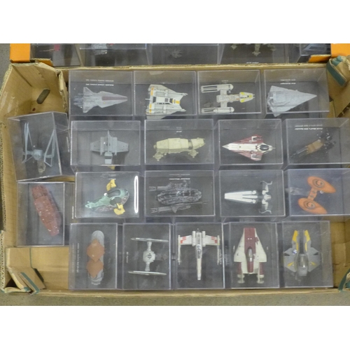 802 - A collection of forty Star Wars vehicles in perspex display cases