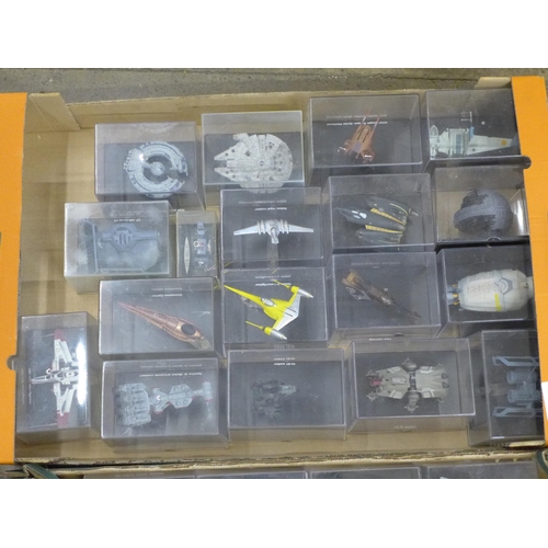 802 - A collection of forty Star Wars vehicles in perspex display cases