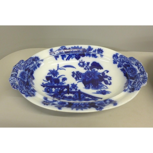 806 - A Royal Stanley ware bowl decorated with flowers, a blue and white asparagus dish and cover and a ha... 