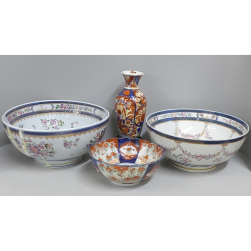 812 - Two large porcelain punch bowls, restored, an Imari vase and an Imari bowl on stand **PLEASE NOTE TH... 