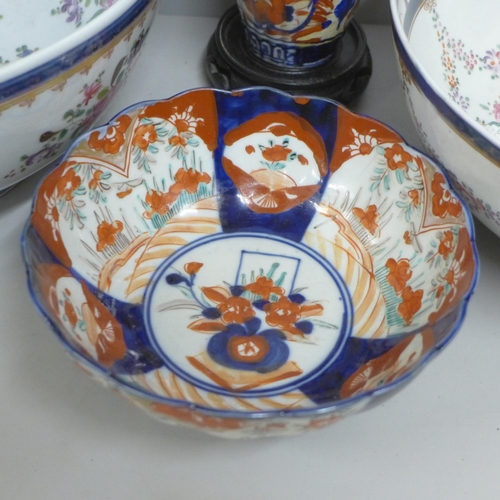 812 - Two large porcelain punch bowls, restored, an Imari vase and an Imari bowl on stand **PLEASE NOTE TH... 