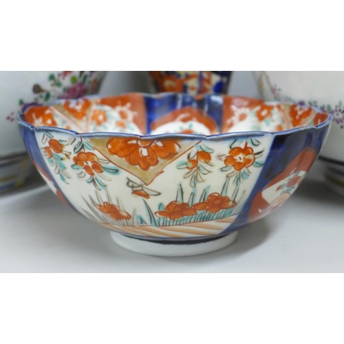 812 - Two large porcelain punch bowls, restored, an Imari vase and an Imari bowl on stand **PLEASE NOTE TH... 