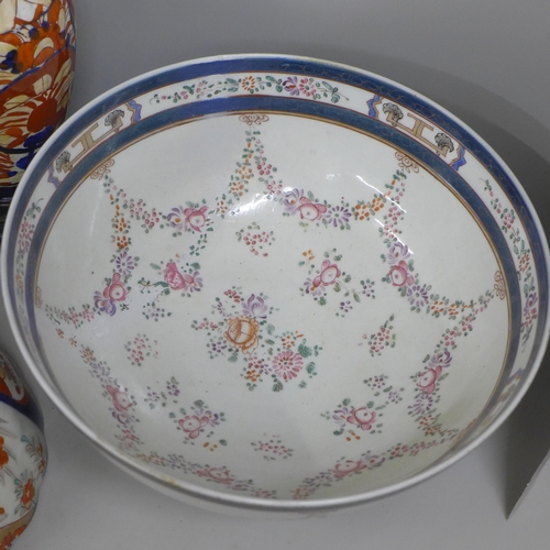 812 - Two large porcelain punch bowls, restored, an Imari vase and an Imari bowl on stand **PLEASE NOTE TH... 