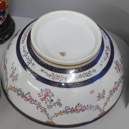 812 - Two large porcelain punch bowls, restored, an Imari vase and an Imari bowl on stand **PLEASE NOTE TH... 